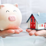 Questions Your Estate Planning Lawyer May Ask - Hands holding a piggy bank and a house model