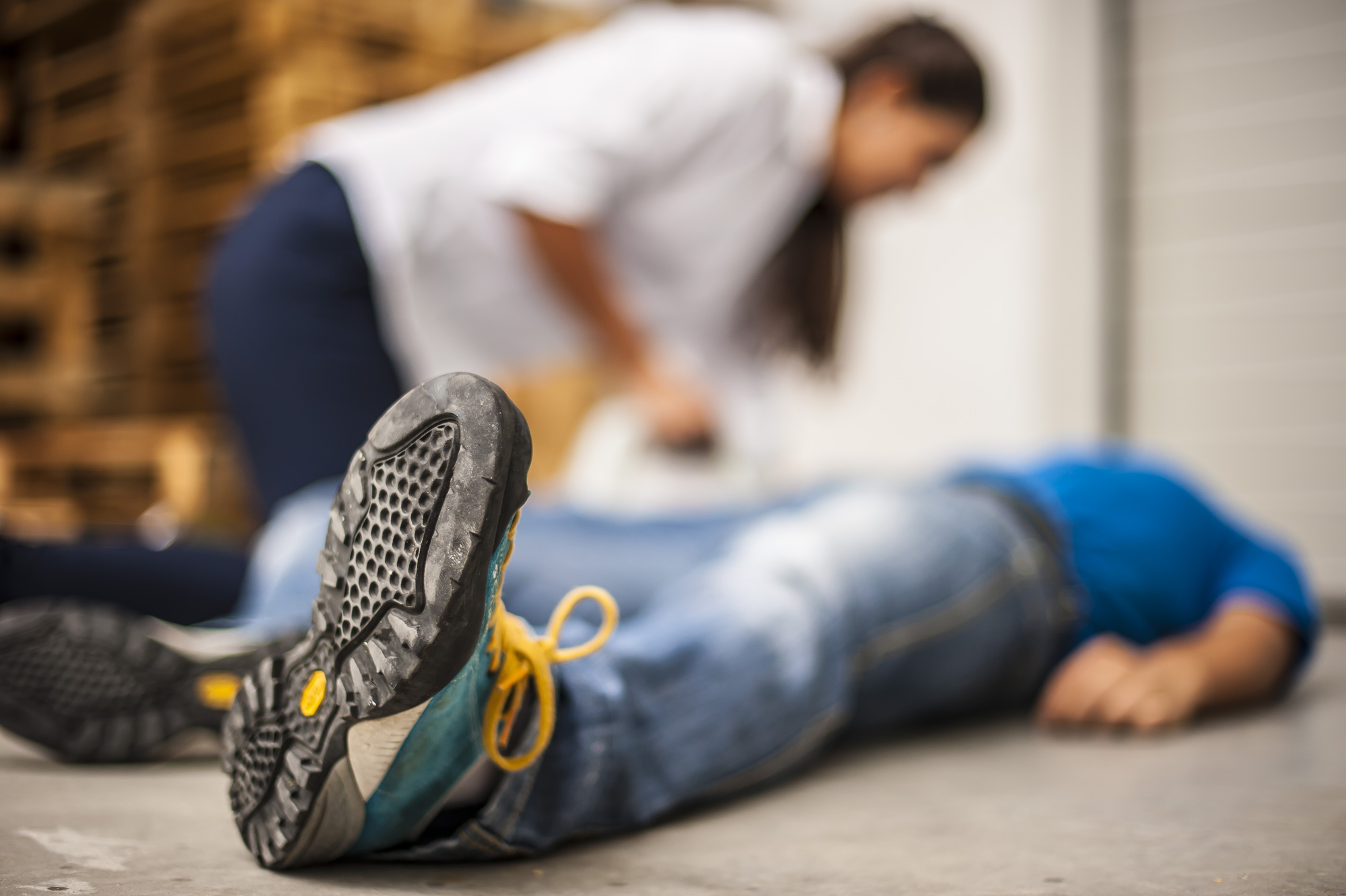 Common Places Where Slip & Fall Accidents Occur - man on floor with woman assisting